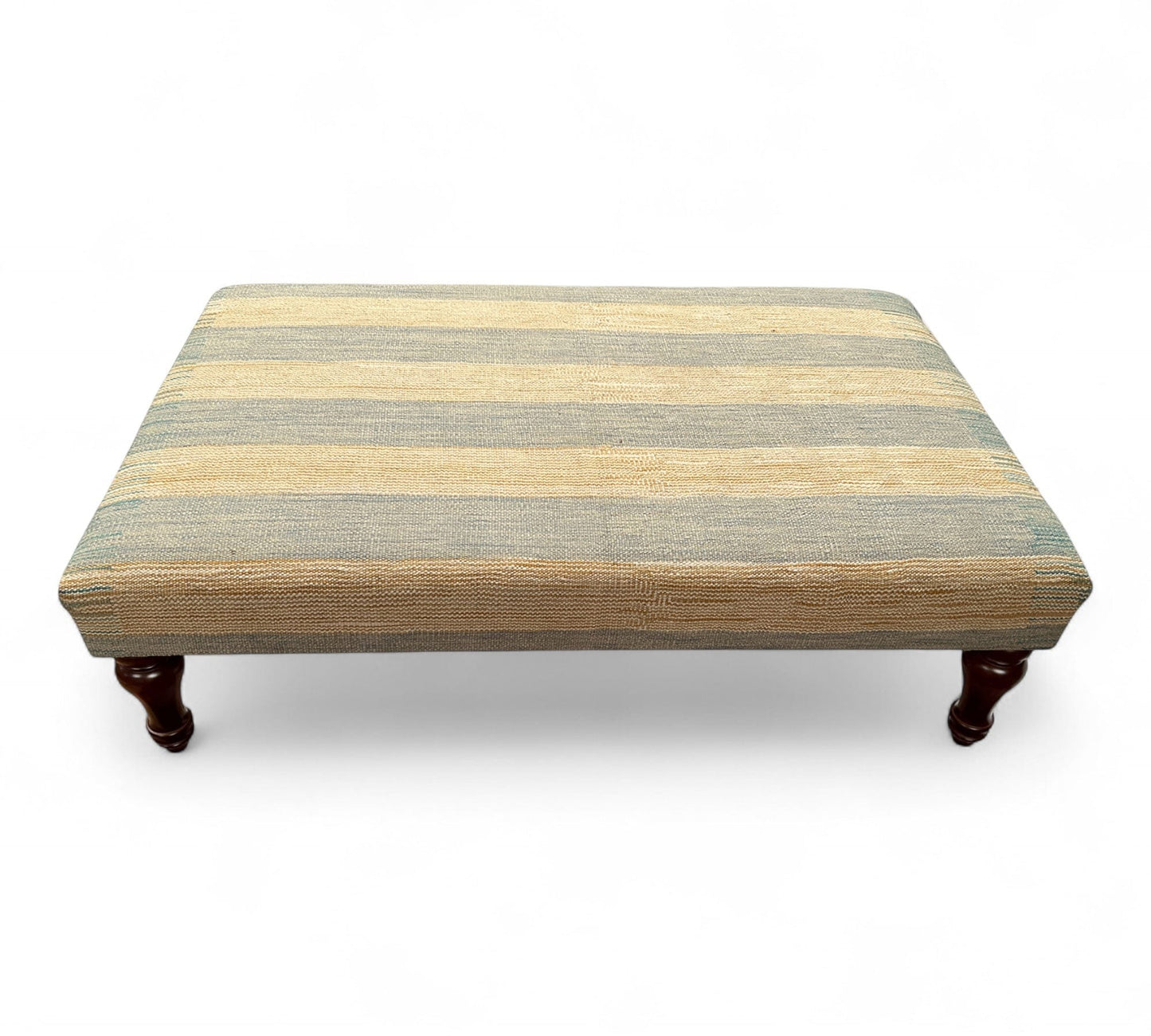 Striped ottoman with wooden legs on a white background