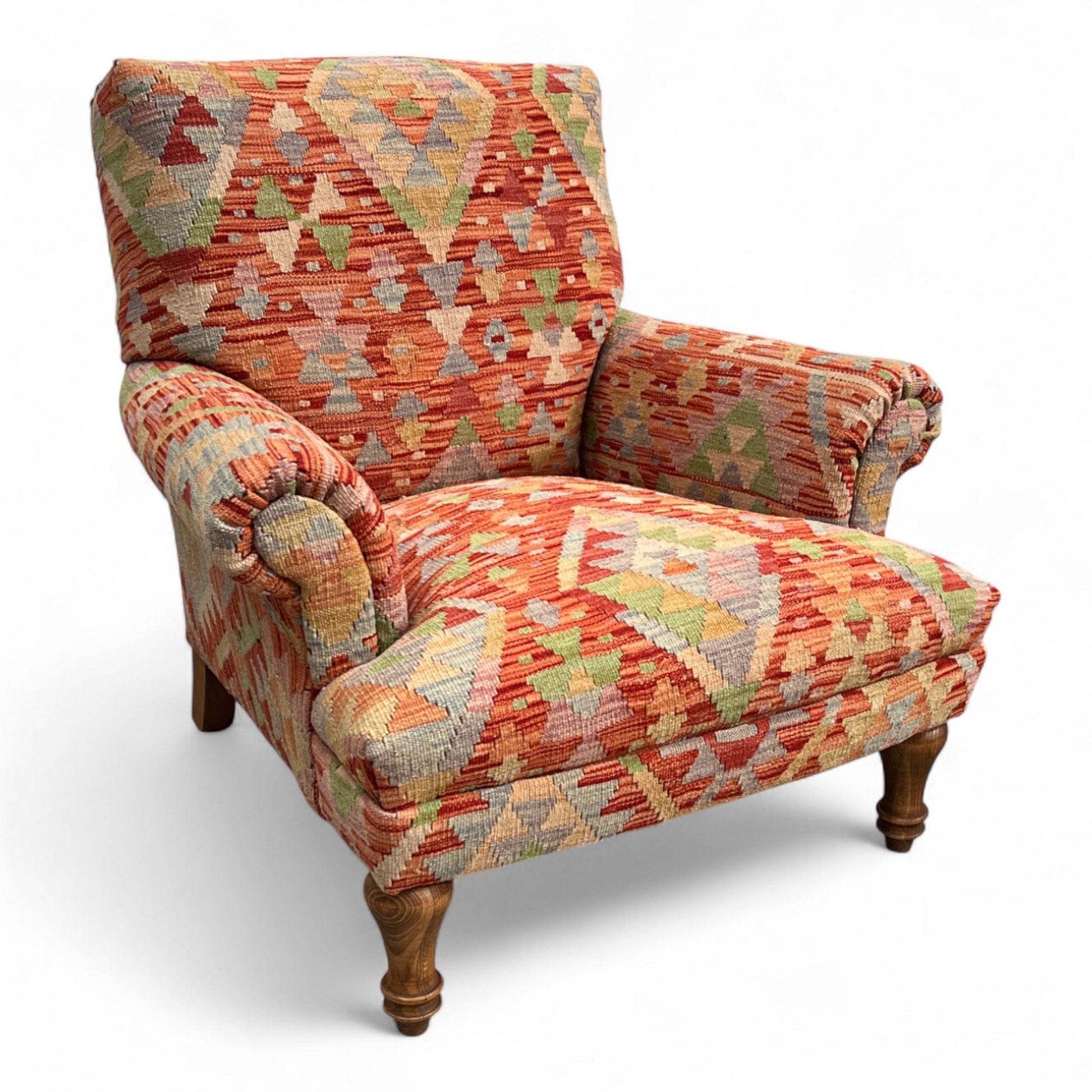 Patterned  Kilim armchair with wooden legs on a white background