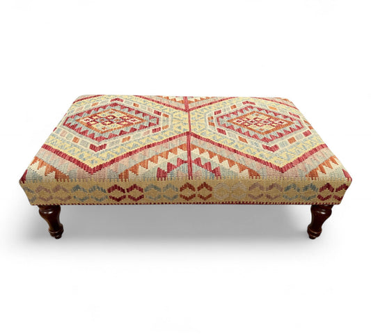 Kilim Table Stool with traditional patterned kilim cover, 120cm x 75cm dimensions, featuring dark brown divan-style legs