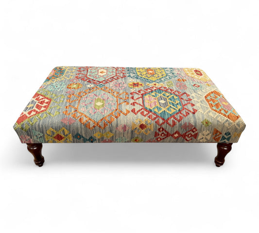 Kilim Table Stool with traditional patterned kilim cover, 120cm x 75cm dimensions, featuring dark brown divan-style legs