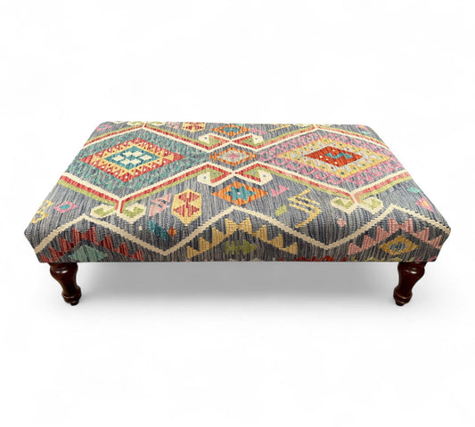 Kilim Table Stool with traditional patterned kilim cover, 120cm x 75cm dimensions, featuring dark brown divan-style legs